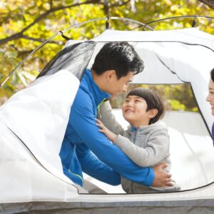 Cheerful family enjoying a camping trip