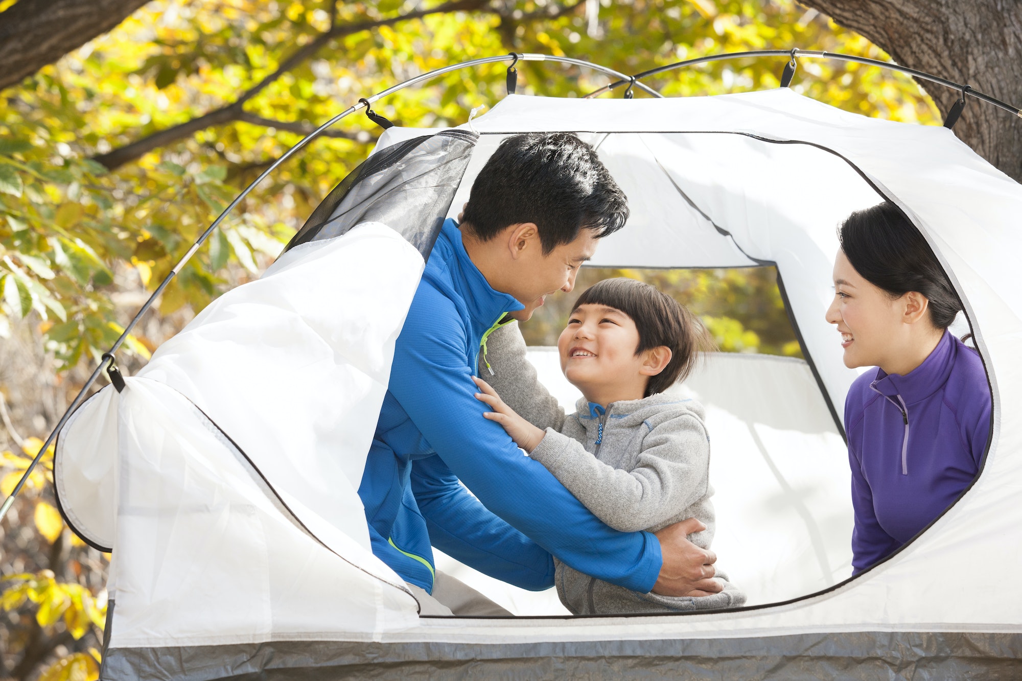 Cheerful family enjoying a camping trip