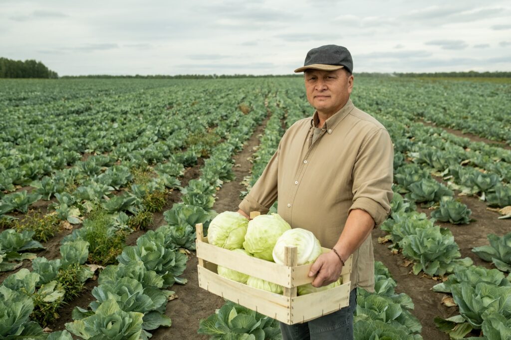 Portrait Of Asian Farm Worker In Field